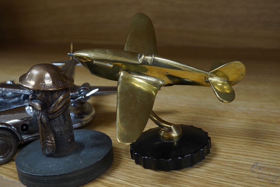 Four car mascots; an ‘Old Bill’ after Bruce Bainsfather, with cast signature to the rim of the helmet, three aircraft, including a stylised fighter plane, and a bomber, together with two chromed clockwork Gaiety Toy cars